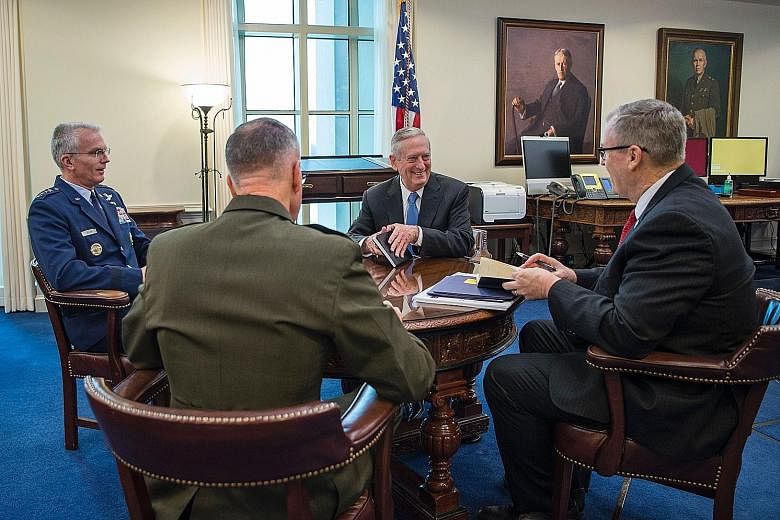 US Secretary of Defence James Mattis (centre) holding his first roundtable session at the Pentagon in Washington last Saturday with (clockwise from right) Deputy Secretary of Defence Bob Work; US Marine Corps General Joseph Dunford, who is the chairm