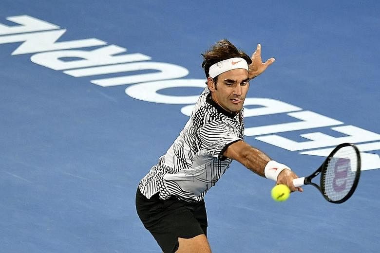 Roger Federer hits a return to Mischa Zverev during their quarter-final clash. The Swiss took just 92 minutes to beat his German opponent in three sets and will next play compatriot Stan Wawrinka.