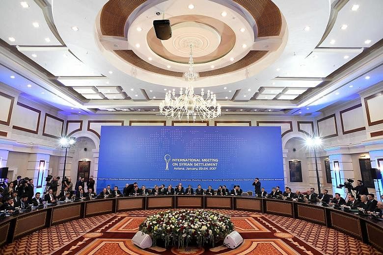 Representatives of the Syrian regime and rebel groups, along with the other delegations, at the peace talks at the Rixos President Hotel in Astana, Kazakhstan.