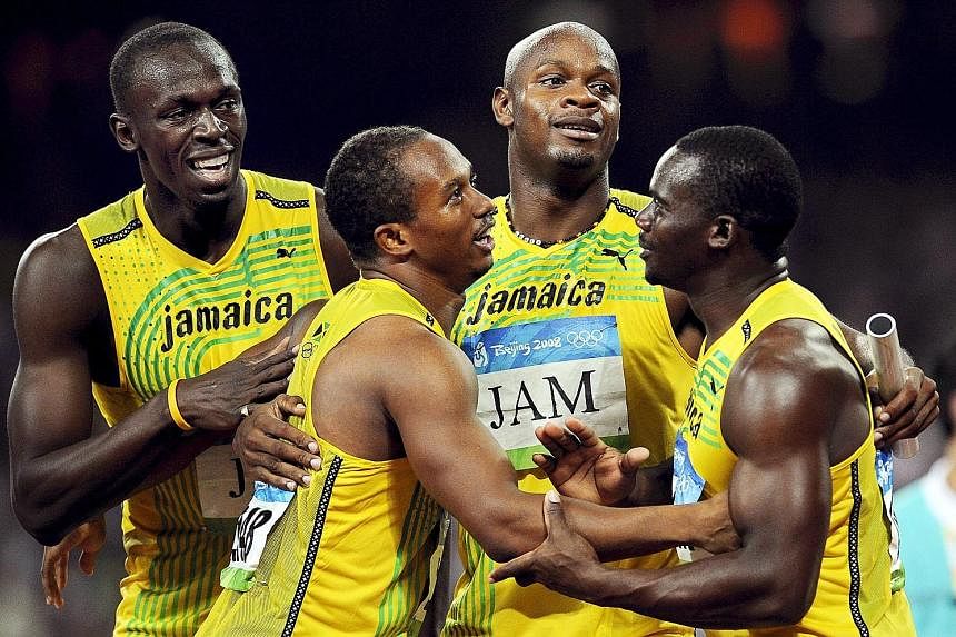 The Jamaica 4x100m relay team celebrating at the 2008 Beijing Olympics. They have been officially stripped of their gold medals after Nesta Carter (right) was found guilty of a doping violation. The medals will now go to the Trinidad and Tobago 4x100