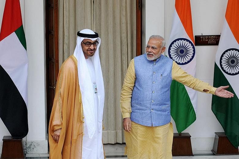 Indian Prime Minister Narendra Modi welcoming Abu Dhabi Crown Prince Sheikh Mohammed Zayed Al Nahyan prior to a meeting in New Delhi yesterday. The Crown Prince is on a state visit to India, where he is the chief guest for the country's Republic Day 