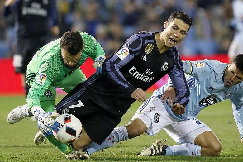 Celta Vigo's defence thwarts Cristiano Ronaldo. The Portuguese scored, but it was not enough as Celta dumped Real out of the Copa del Rey, winning 4-3 on aggregate to progress to the semi-finals.
