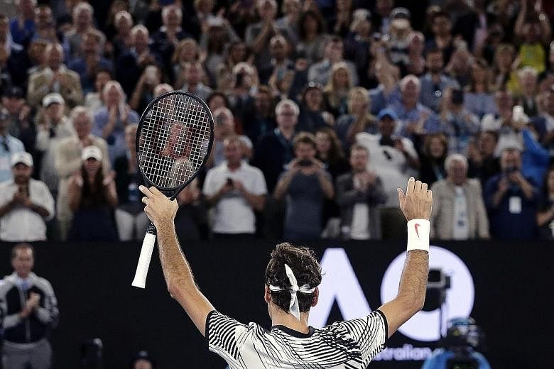 Roger Federer, taking in the Melbourne crowd's adulation after his semi-final win, has reached his 28th Grand Slam final, 14 years after his first one, with his five-set victory over fellow Swiss Stan Wawrinka.