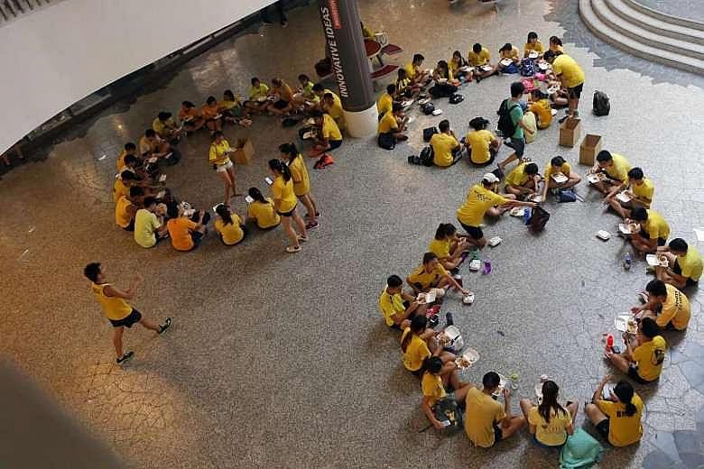 NUS students participating in orientation activities, such as this one at University Town last June (above), will have to abide by a new set of rules. The change came after a furore last year over inapproriate orientation activities (below).