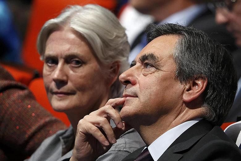 French presidential candidate Francois Fillon with his wife, Penelope. The father of five has run his campaign on an image of Christian values, but he is facing blowback over claims that Mrs Fillon took public money without cause.