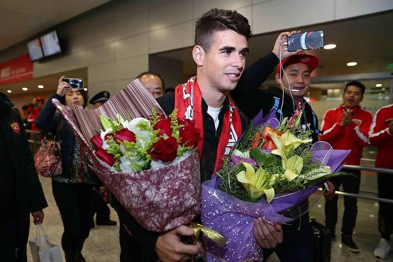 Brazilian midfielder Oscar creating a stir on his arrival in Shanghai on Jan 2. The 25-year-old midfielder's £52 million (S$93 million) move to Shanghai SIPG smashed the Asian transfer record. His deal was one of many that helped put China among the