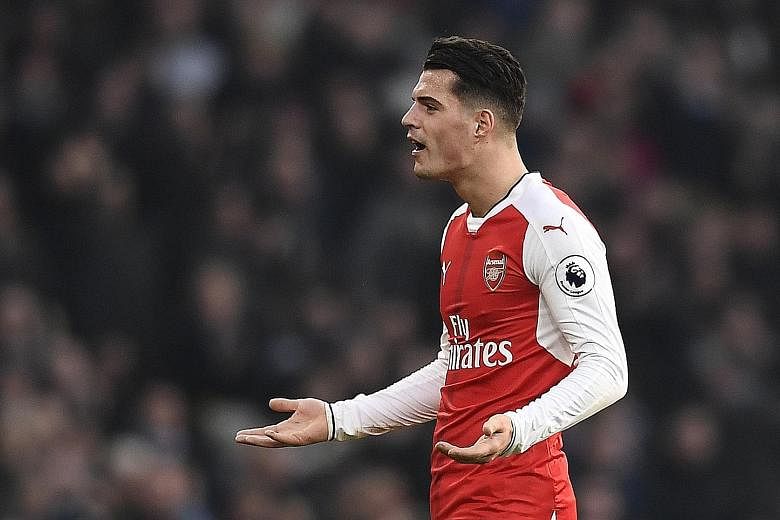 Granit Xhaka protests after being given his marching orders against Burnley. Since the start of the 2015-16 season, he has been sent off more times - five - than any other player in Europe's top five leagues.