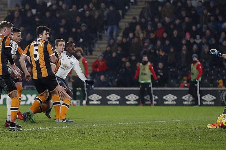 Paul Pogba scoring Manchester United's goal that proved enough to send his side through to the League Cup final on aggregate, despite their 2-1 defeat by Hull on the night. They will face Southampton in the final.