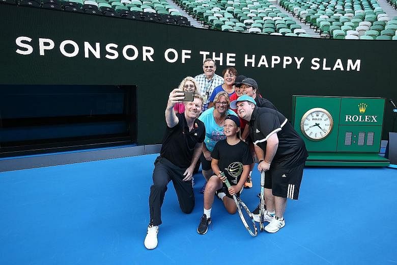 Former world No. 1 Jim Courier, a Mastercard ambassador, taking a wefie with fans at Rod Laver Arena. He also played tennis with cardholders on centre court during the Australian Open.