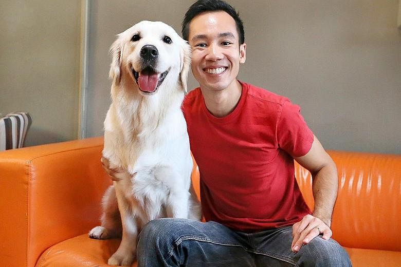 Mr Ethan Loke with his golden retriever Boo. He did not have a dog when he was growing up as his parents did not allow it.
