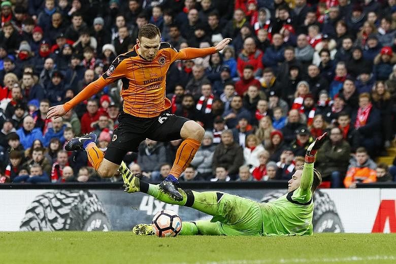 Wolves forward Andreas Weimann scores the winner against Liverpool in the FA Cup. The under-fire Reds will be hoping to get their season back on track with a positive result against Premier League leaders Chelsea.