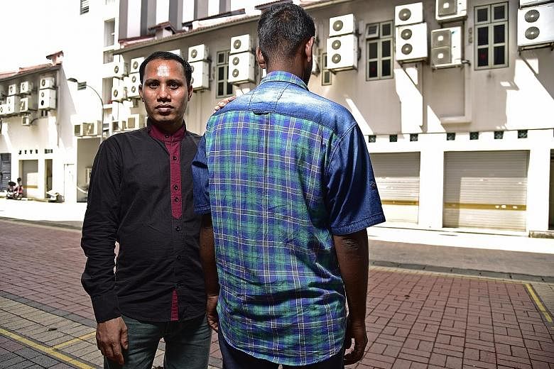 Mr Sohag Fazlul Haque (left) and Mr S. Kumar are foreign workers who have been victims of what the Humanitarian Organisation for Migration Economics has termed "wage theft". SEE HOME B2