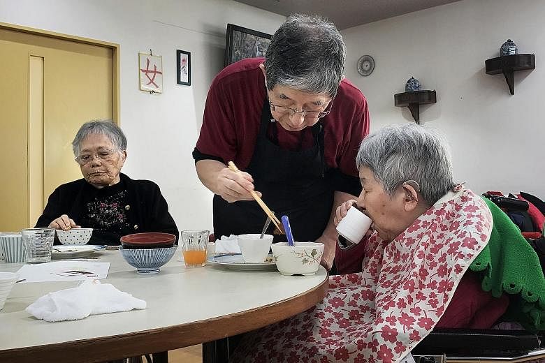 Mr Kunio Odaira (centre), 72, is a caregiver at the Cross Heart rest home in Yokohama, Japan. More than half of the staff there are over 60 years old.
