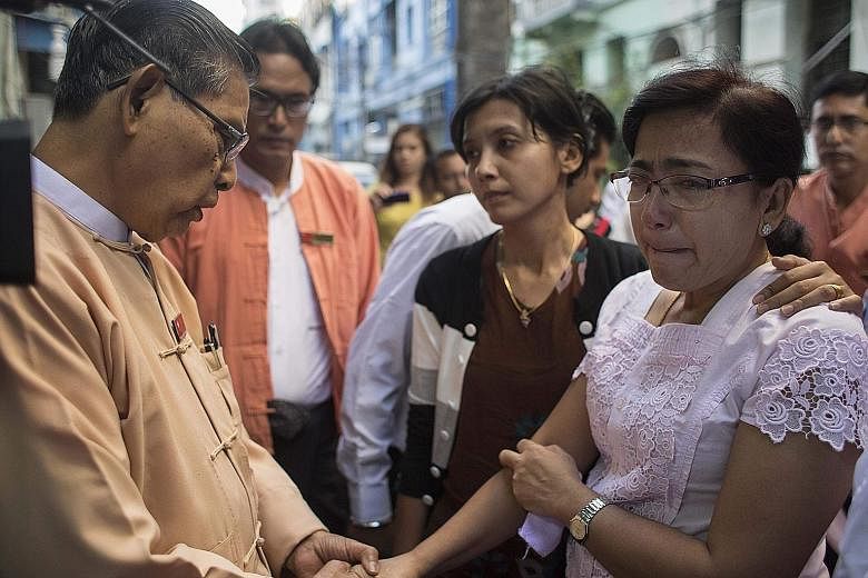 The ruling National League for Democracy's patron, Mr Tin Oo, consoling Mr Ko Ni's widow Tin Tin Aye at the family home in Yangon. Mr Tin Oo called the killing an "assassination" and said Mr Ko Ni's death was a "great loss for the country". Mr Ko Ni 