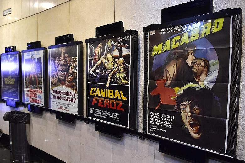 Posters advertising trash movies at the entrance of a cinema in Madrid.
