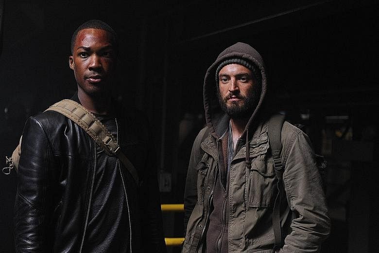 Corey Hawkins (far left, with actor Charlie Hofheimer) plays a former member of an elite Army Ranger squad in 24: Legacy.