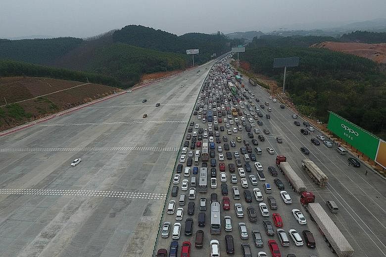 An aerial shot yesterday showing a massive jam on an expressway in Nanning as people travel out of Guangxi region to other parts of China in a reversal of the massive migration home for Chinese New Year. Yesterday also marked the end of the Spring Fe