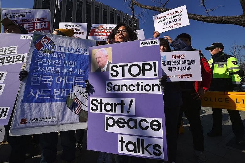 The US Defence Secretary's visit was met with anti-war activists' protests against the Thaad deployment and a pro-Trump rally by Christians.