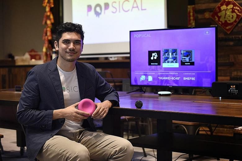 Mr Faruq Marican with Popsical, a portable karaoke system which can be plugged into any television set for a karaoke-on- demand experience.
