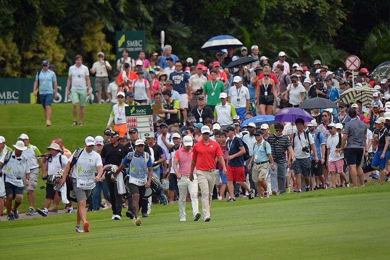 A large crowd following world No. 7 Adam Scott of Australia, a three-time Singapore Open champion, as he walked towards the eighth green during the final round last month.