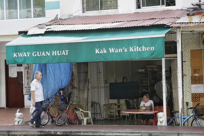 Mr Quek (top), co-owner of Kway Guan Huat Joo Chiat Popiah & Kueh Pie Tie (above), making popiah skin in his younger days.