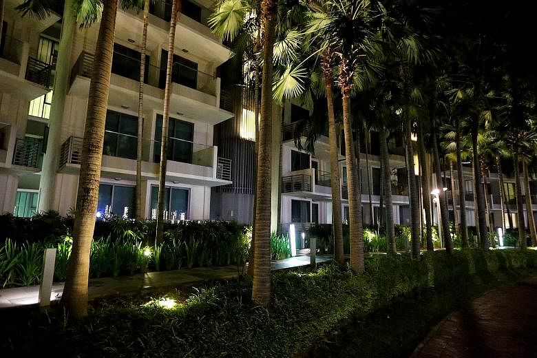 Many units at The Residences at W in Sentosa Cove (above) were unlit when The Sunday Times visited at 9.30pm on Thursday. In the Core Central Region (CCR), which includes Sentosa, the private home vacancy rate at the fourth quarter last year was 9.6 