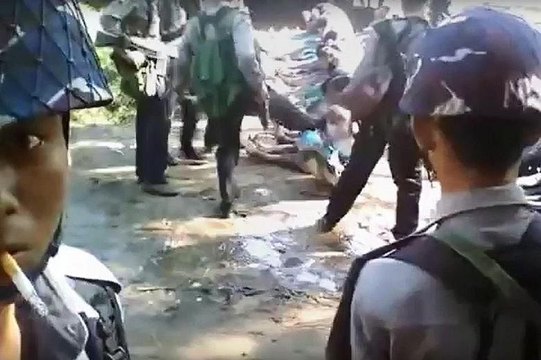A YouTube video (left) showing a policeman kicking a Rohingya villager during an area clearance operation (below) in Kotankauk village last November. Myanmar has denied almost all the allegations of human rights abuses against the Muslims in northern