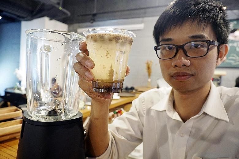 Mr Ron Chiang, the owner of Old Major Cafe in Taipei, Taiwan, raises a cup of Smog Juice. He created the beverage to call attention to the air pollution which has caused smog in China, India, Taiwan and other places. The drink, which costs NT$130 (S$