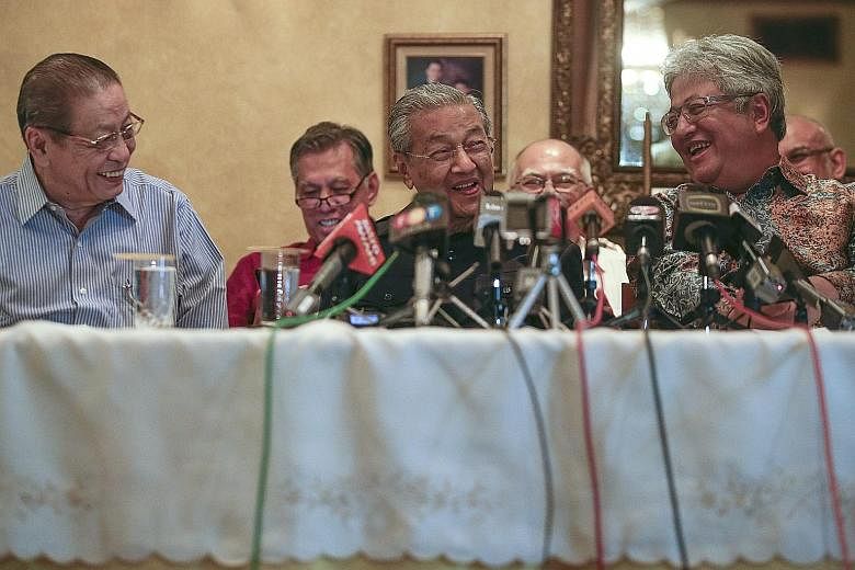 (From left) DAP stalwart Lim Kit Siang, Tun Dr Mahathir Mohamad and former law minister Zaid Ibrahim at yesterday's press conference, when Mr Zaid announced that he was joining the Chinese-majority DAP. Leaders of the opposition party said they have 