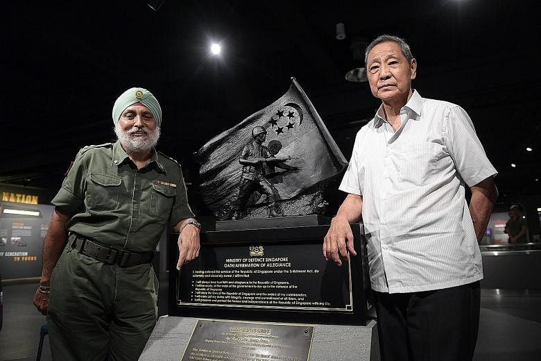 Retired senior warrant officer Ong Hui Pheng with one of his trainees, retired lieutenant-colonel Albel Singh, who was first in line to register for NS in March 1967.