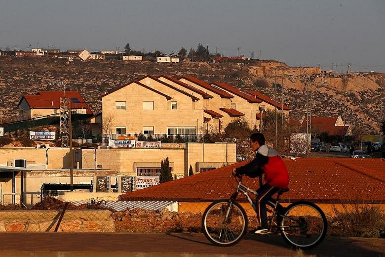 Israel has passed a law retroactively legalising about 4,000 settler homes built on privately owned Palestinian land in the occupied West Bank. However, the law contravenes Israeli Supreme Court rulings on property rights.