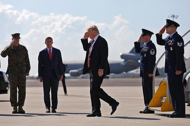 Mr Trump arriving at MacDill Air Force Base in Tampa, Florida on Monday. He promised an unspecified "historic financial investment" in the US military.