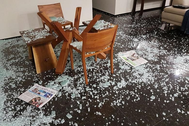 A mouldy wardrobe. SEE HOME B2 Ms Tan Li-Lin and her husband returned home from work last Tuesday to find this scene. It was only after checking their home for any burglary that they realised their dining table's glass top had shattered on its own.