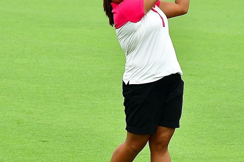 Amanda Tan playing in the HSBC Women's Champions qualifying tournament at Sentosa Golf Club yesterday. The 17-year-old edged out overnight leaders Callista Chen, 18, and Sarah Tan, 19, in a three-way play-off to qualify for the prestigious event for 