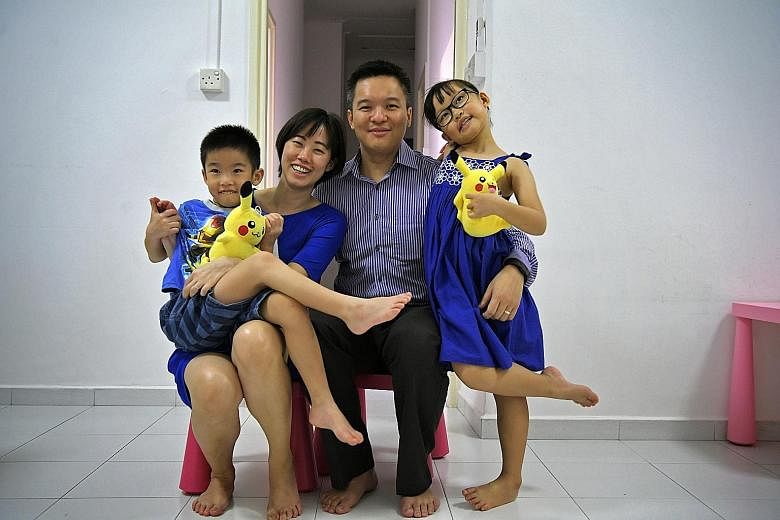 Above: Mr Chua, his wife Angel and their son Ace. As a result of their three-year stay in Dubai, Ace had to catch up on his studies and get used to a "different culture" in school here upon their return. Left: Mr Toh, his wife Melissa and their son N