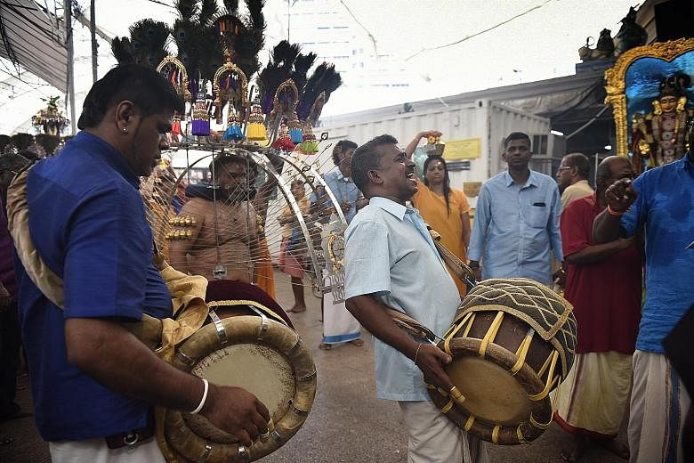 Participants at the Sri Srinivasa Perumal Temple in Serangoon Road yesterday. For the second year running, live music was permitted at the procession.