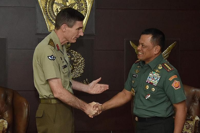 Lt-Gen Campbell (far left) and Gen Gatot met at the TNI headquarters in Cilangkap on Wednesday. Lt-Gen Campbell provided an update on his country's investigation into training materials that the Indonesian military deemed offensive.