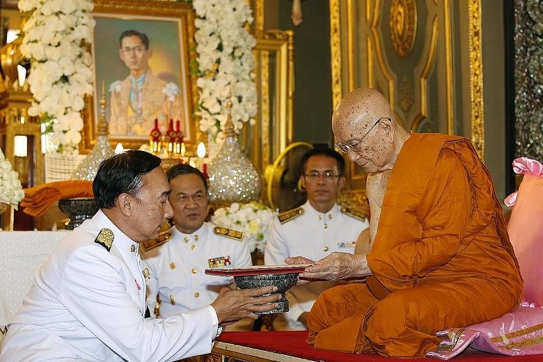 Thai Buddhist monk Somdet Phra Maha Muneewong (at right), 89, the abbot of Wat Ratchabophit temple, has been chosen to become the 20th Supreme Patriarch of Thailand. He was formally invited to attend an investiture ceremony for his new role by Prime 