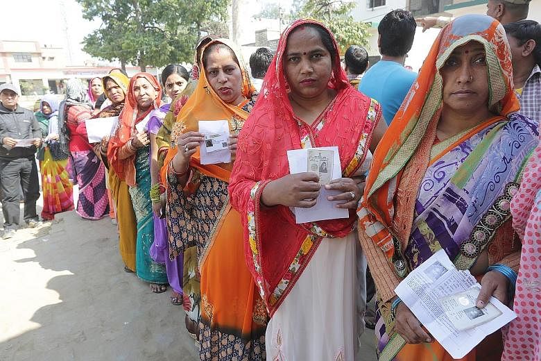 Voters waiting to cast their ballots in Dadri constituency in Uttar Pradesh yesterday. The state sends 80 MPs to the Lower House of Parliament.