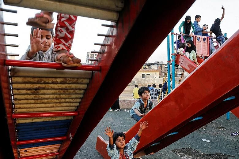 Children playing on broken slides in a public park at Dharavi in Mumbai, an area that is one of Asia's largest slums. Estimates say the city has over 37,000 street children. Many migrated to Mumbai with their families who were seeking better prospect