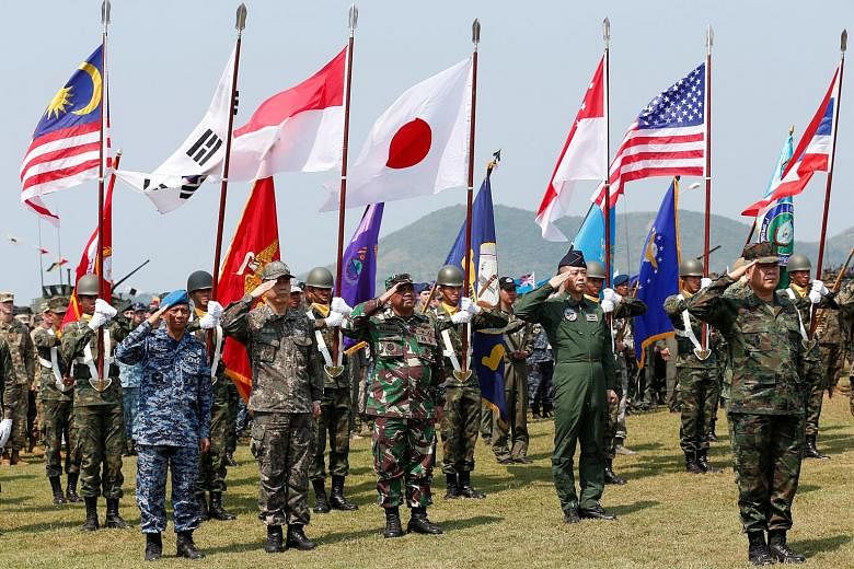 Soldiers from different Asia-Pacific countries at the opening of the Cobra Gold war games at Sattahip Royal Thai Marine Corps Base in Chonburi, Thailand, yesterday.