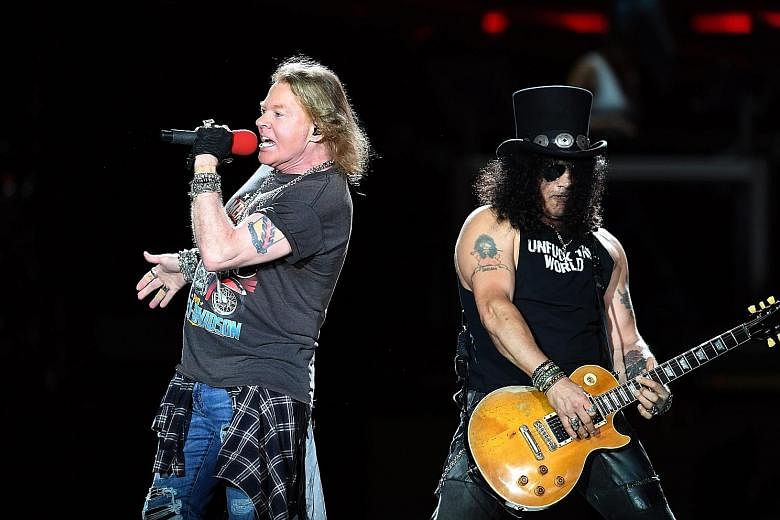 Lead singer Axl Rose (above left) and guitarist Slash of rock band Guns N' Roses perform in Brisbane, Australia.