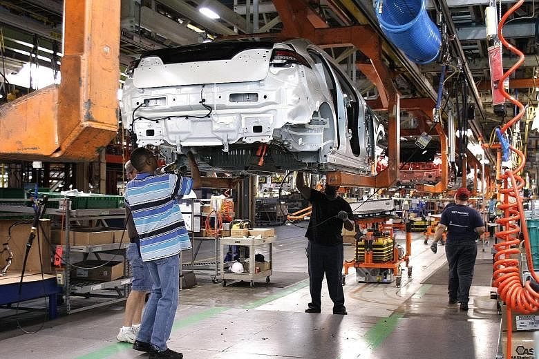 A General Motors plant in Michigan. Suppose the Trump administration forced through changes in Nafta so as to bring all parts of the car production process back to the US. The result will be to make US-produced cars more expensive. How is that going 