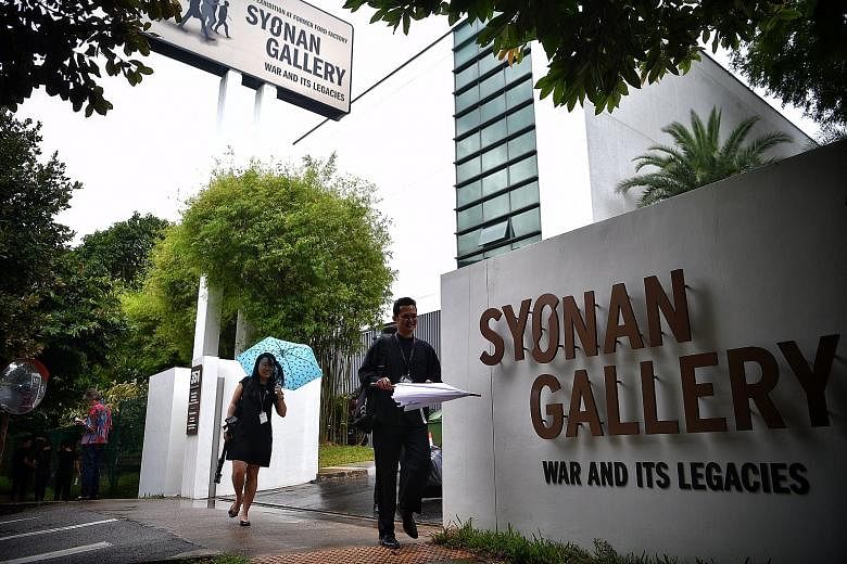 (Above and left) Signs in front of the building and by the road now reflect the gallery's full name "Syonan Gallery: War and Its Legacies", and include the phrase "An Exhibition at Former Ford Factory". The name "Syonan Gallery" had upset some Singap