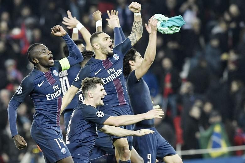 Victory salutes by (from left) Paris Saint-Germain's Blaise Matuidi, Thomas Meunier, Layvin Kurzawa and Edinson Cavani after the 4-0 victory against Barcelona. 