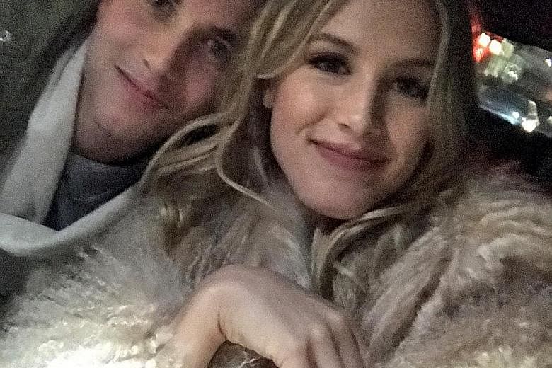 World No. 44 tennis player Eugenie Bouchard taking a selfie with her blind date John Goehrke. She posted this picture in a tweet with a message that read: "Just met my 'Super Bowl Twitter Date' John. On our way to the @BrooklynNets game! @punslayintw
