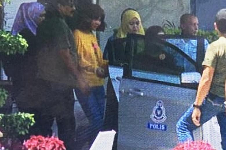 A still image from footage broadcast by Chinese state media is believed to show the second woman (in yellow top) suspected of involvement in the killing of Mr Kim Jong Nam.