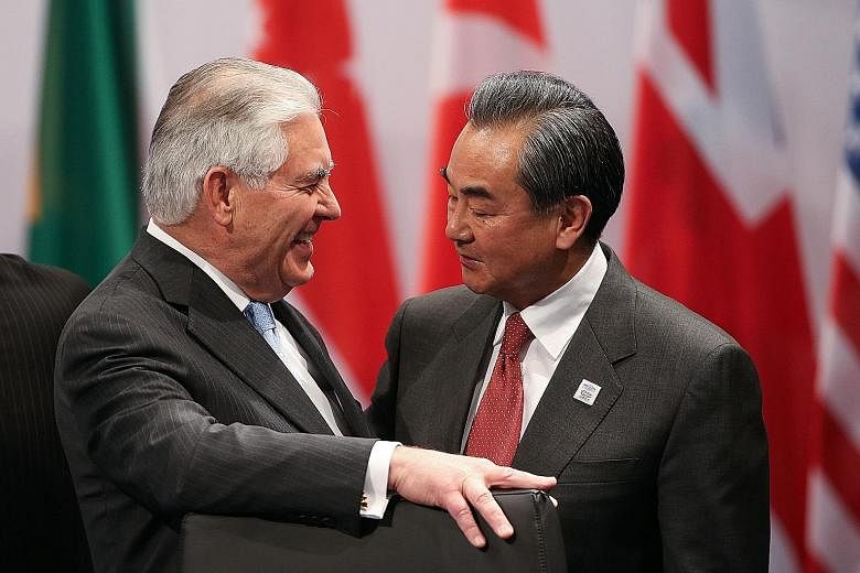 Mr Tillerson and Mr Wang at the Group of 20 foreign ministers' meeting in Bonn, Germany, on Thursday. Their meeting yesterday was the highest-level Sino-US encounter since President Trump was elected.