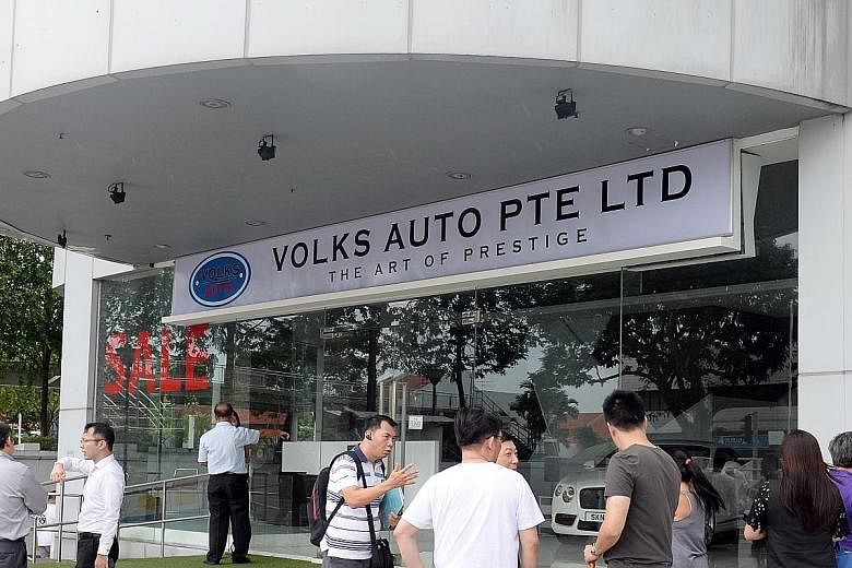 Koh (above) and two alleged accomplices still at large set up Volks Auto (left) in MacPherson Road, collected the deposits but did not deliver a single car.