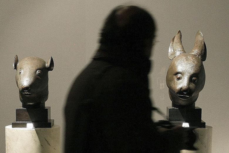 Left: Bronze heads of a rabbit and a rat made for a zodiac fountain in the Yuanmingyuan Summer Palace in China. Below left: Fossil of a 220-million- year-old predatory fish. Through various ways and means, China has got these plundered cultural and h